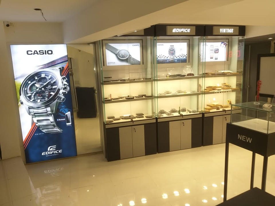 Watch boutique with backlit glass display cabinets